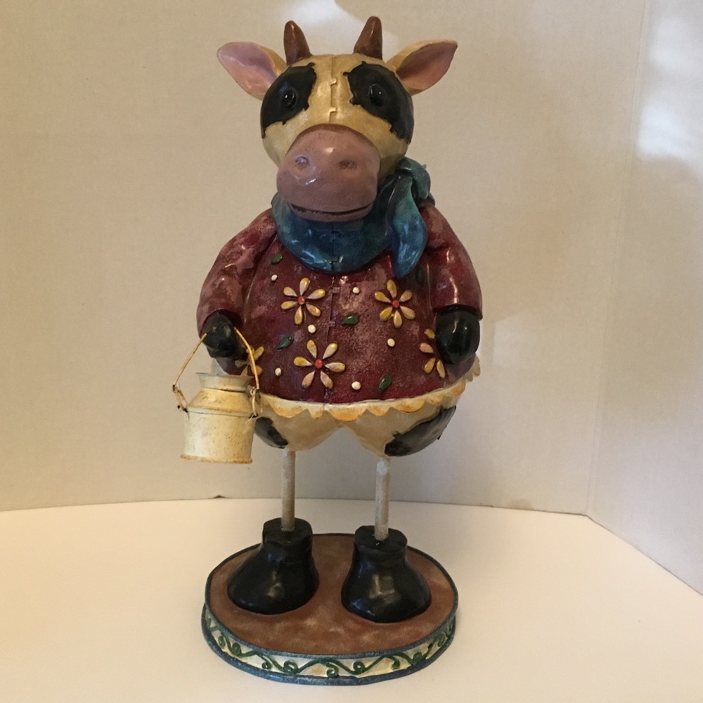 Country Cow holding a Milk Jug.